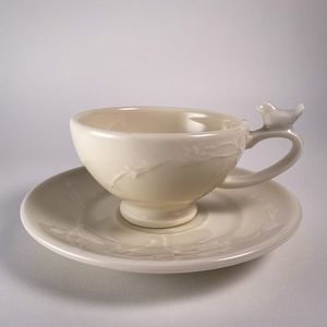 Earthenware Teacup with bird on handle